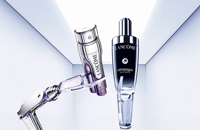 A minimalist display featuring three elegant perfume bottles positioned on a softly lit background, suggesting luxury and sophistication.