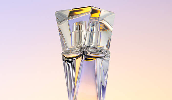 A stylish glass perfume bottle with a geometric design against a softly blended pastel background.