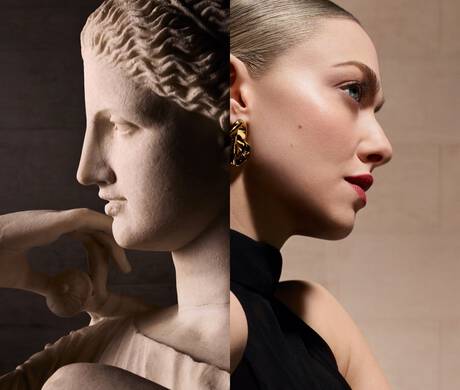 A side-by-side comparison of a classical marble sculpture of a woman and a modern portrait of a woman, highlighting their similar profiles. The sculpture depicts a thoughtful expression, while the portrait features a fashionable woman with striking makeup and accessories.