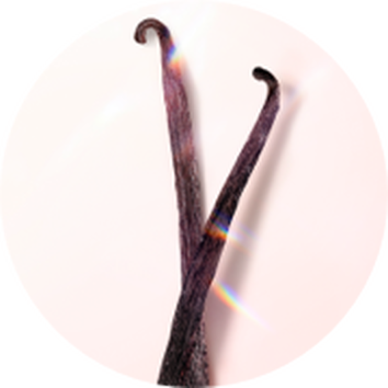 Ket sotetbarna vaniliarud, izleses hatter előtt, amelyen szivarvanyfenyek csillognak.