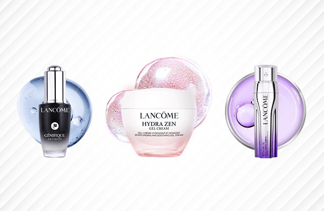 Three Lancome skincare products are displayed: a serum in a black bottle, a white cream jar labeled "Hydra Zen," and a serum in a silver bottle. The background features a subtle geometric pattern.