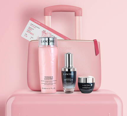 A pastel pink suitcase alongside skincare products, including a bottle, a serum, and a cream, all arranged against a soft pink background.
